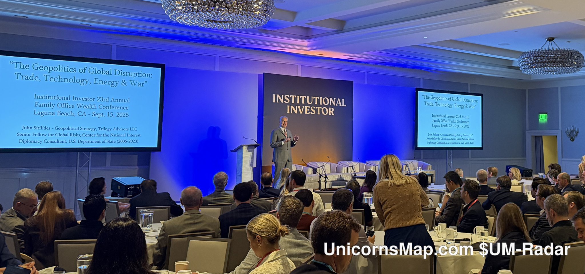 II 23rd Annual Family Office Wealth Conference 2026 — keynote stage at the Montage Laguna Beach: agenda speaker at the podium beneath the Institutional Investor backdrop, dual screens naming the conference and Laguna Beach, CA, Sept. 15 2026 (post-event recap photograph)