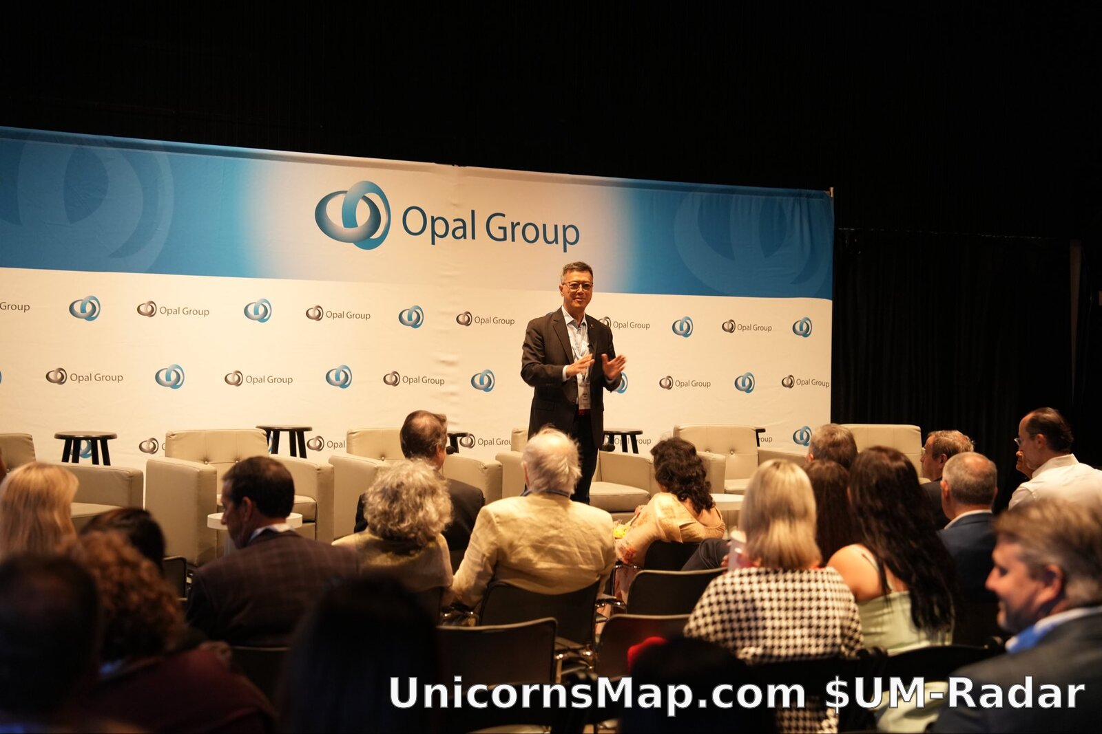Speaker on stage at Opal Group Legacy Summit 2026, Hamptons
