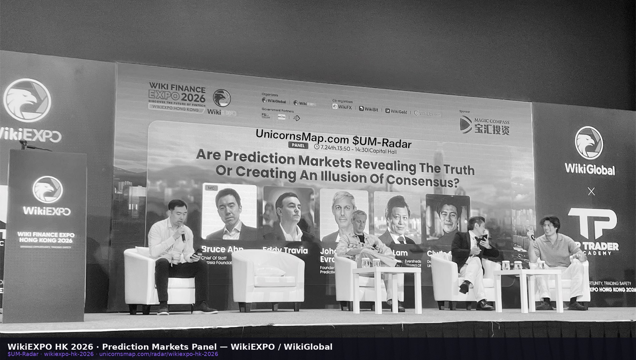 WikiEXPO HK 2026 prediction markets panel — stage + name-tagged headshots, watermarked ($UM-Radar)