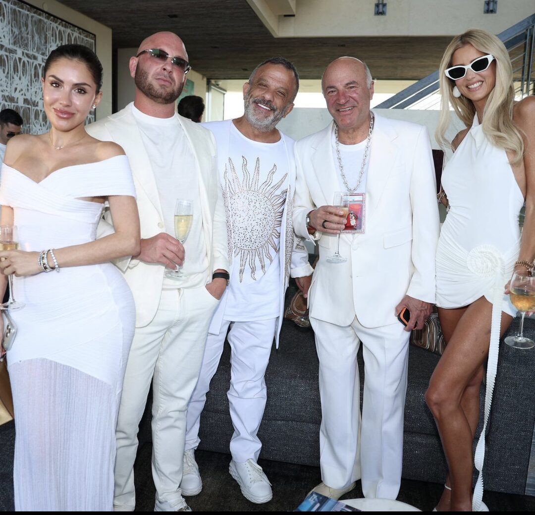 Adam Weitsman at White Party 2026 — group photo, sun-motif white outfit